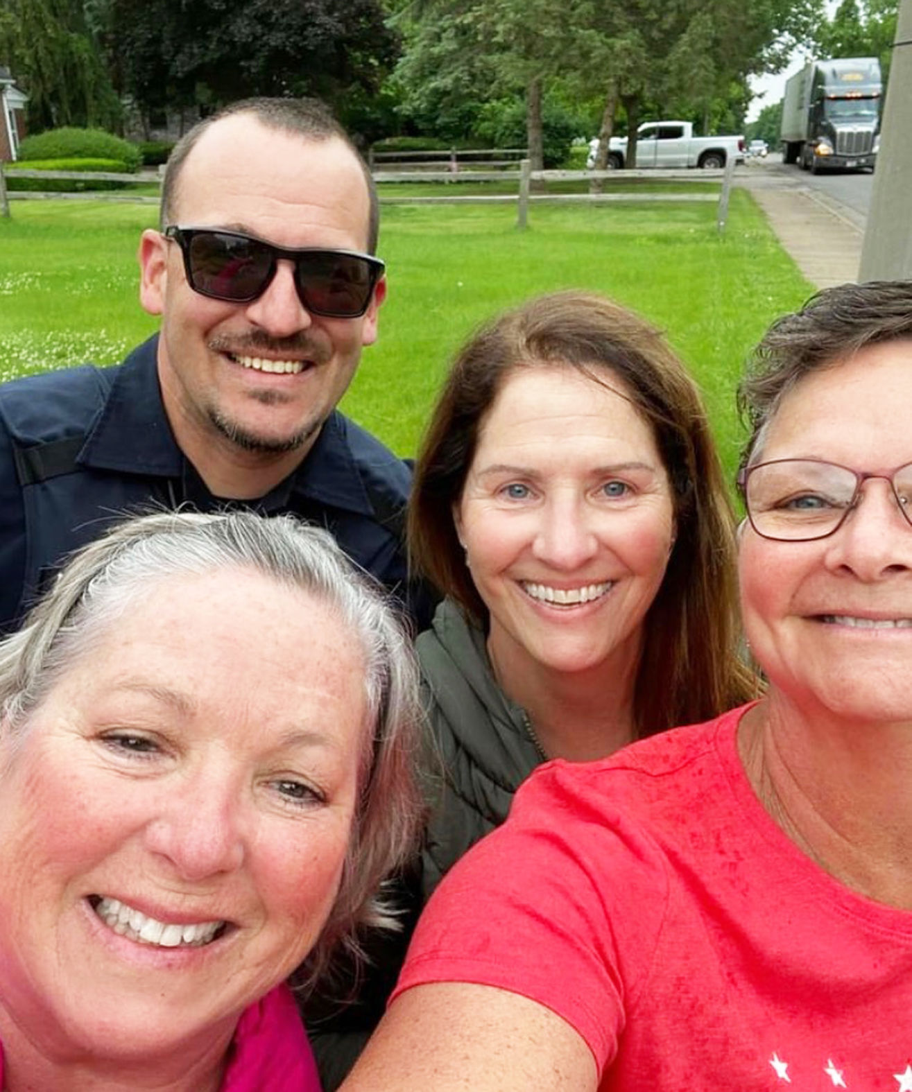 Officer helps Danville Rotary with flags.jpg